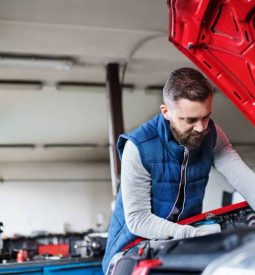 man-mechanic-repairing-a-car-in-a-garage-.jpg